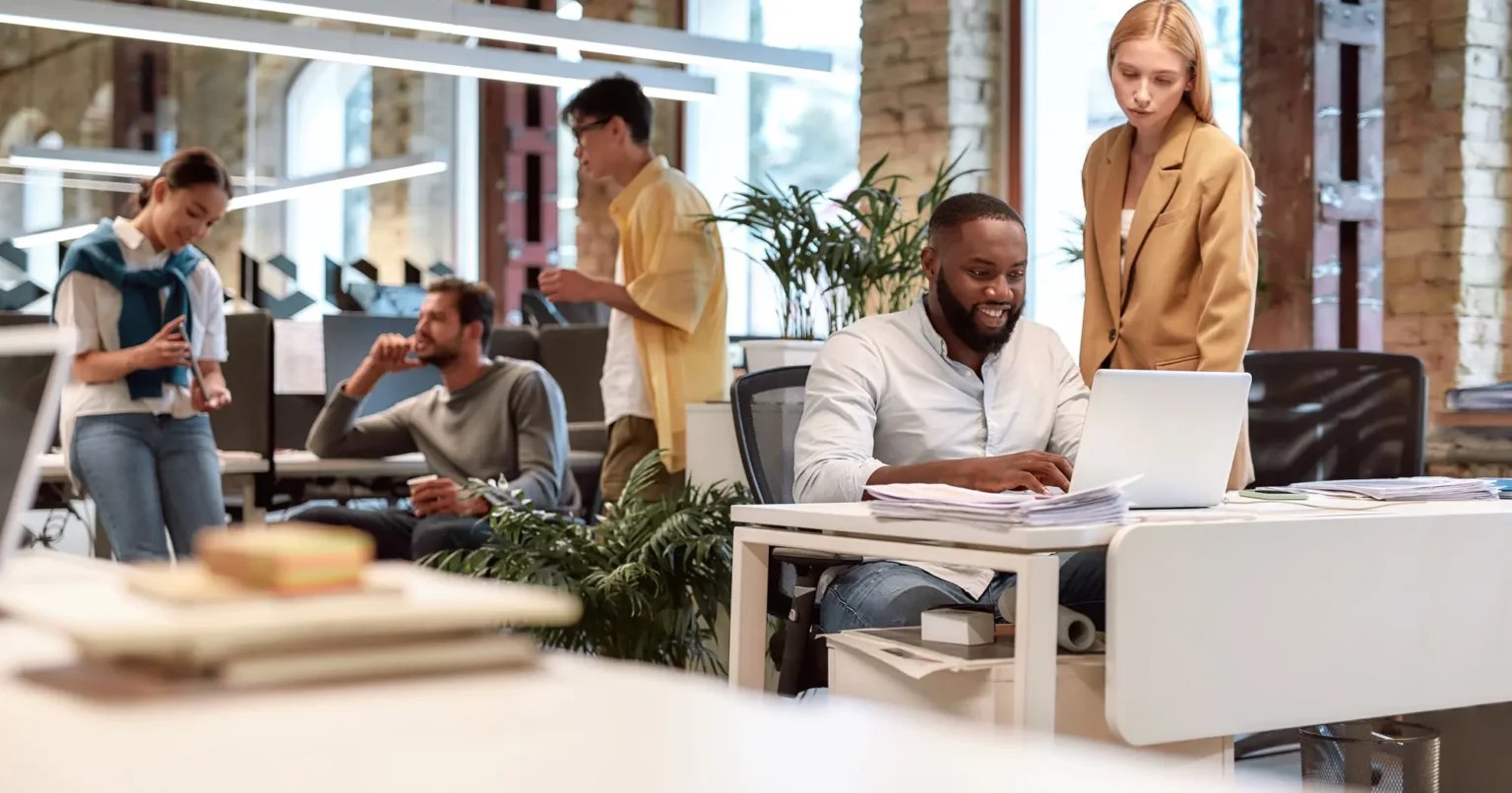 Business owner meeting with a professional website design agency before hiring a web design partner